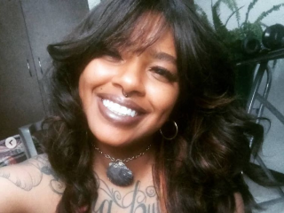 orangemelanin webcam girl as a performer. Gallery photo 1.